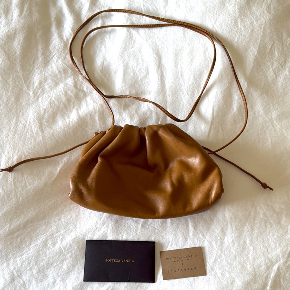 Authentic Bottega Veneta mini pouch in the color camel (gold). ✨